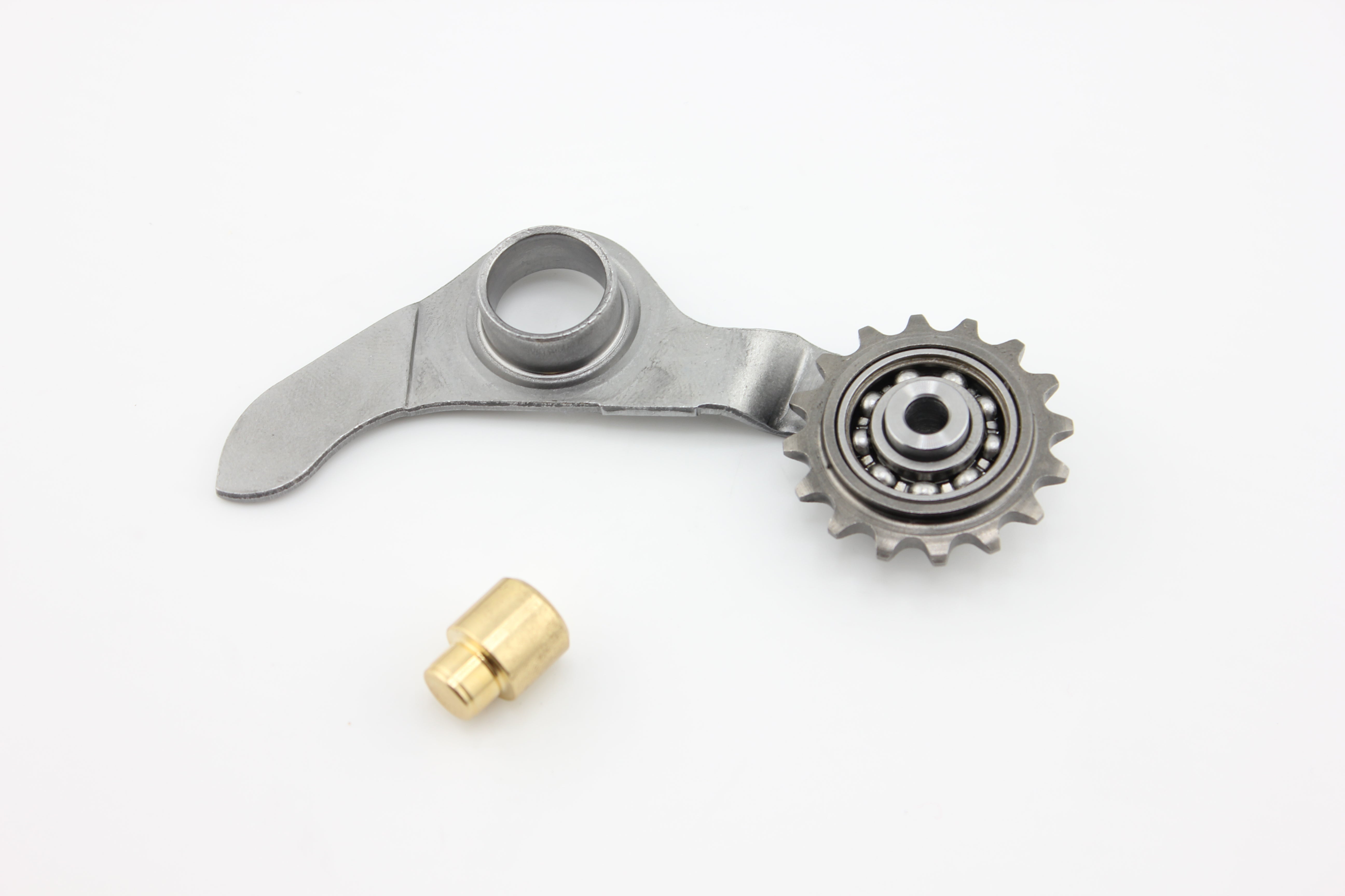 Roller bearing timing chain tensioner with brass extension